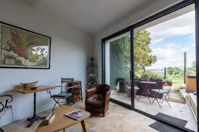 a living room with a large sliding glass door at Terre Luberon in Pertuis