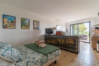 a bedroom with a bed and a dresser at Terre Luberon in Pertuis