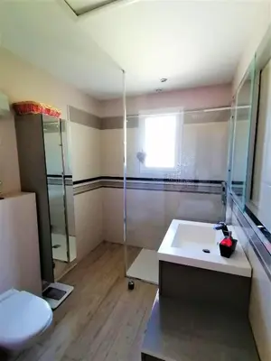 a bathroom with a shower and a sink and a toilet at JULIANA in Eyragues