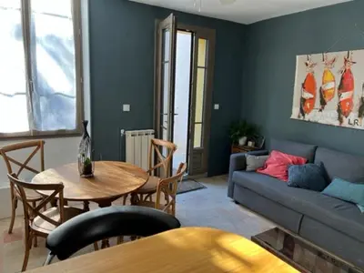 a living room with a couch and a table at Appartement Mas de Silvacane in La Roque-dʼAnthéron
