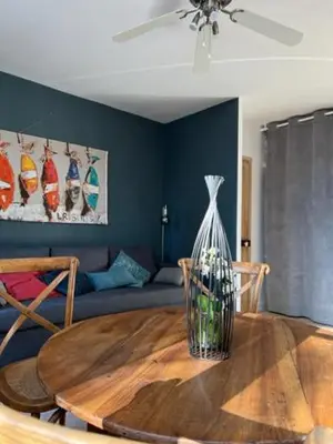 a living room with a table and a couch at Appartement Mas de Silvacane in La Roque-dʼAnthéron