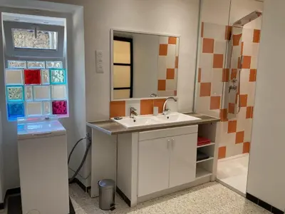 a bathroom with a sink and a mirror at Pélissanne, superbe appartement entièrement rénové in Pélissanne