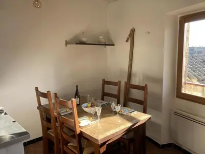 a dining room table with chairs and a bowl on it at Pélissanne, superbe appartement entièrement rénové in Pélissanne