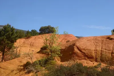 a rock formation with a tree on top of it at CABANE perchée dans les arbres in Robion en Luberon