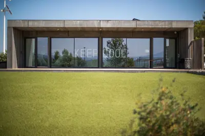 a building with a lawn in front of it at thecamp hôtel - Aix en Provence in Aix-en-Provence