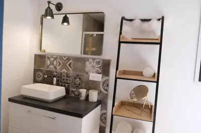 a bathroom with a sink and a mirror at villa with pool and beautiful view in the luberon in pujet sur durance - 10 in Puget