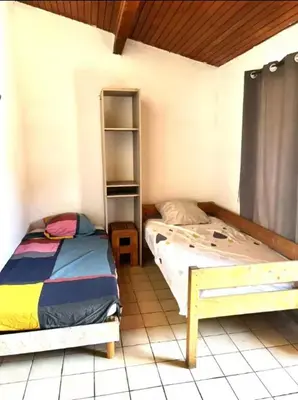 a bedroom with two beds in a room at Appartement charmant à Avignon - 50 m² - Terrasse privée in Avignon