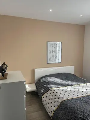 a bedroom with a bed and a white desk at Logement privé à proximité du Mont Ventoux in Carpentras