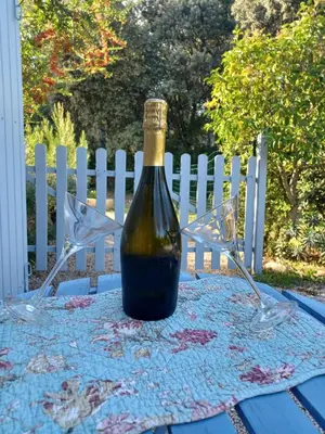 a bottle of wine sitting on top of a table at Bastide Cedrea in Peyrolles-en-Provence