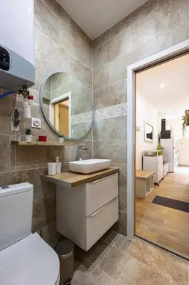 a bathroom with a sink and a mirror at Exotic Stones Hyper Centre Fontaine Moussue in Salon-de-Provence