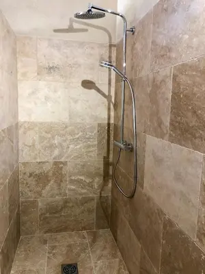 a shower with a shower head in a bathroom at La Verrière à Bonnieux in Bonnieux