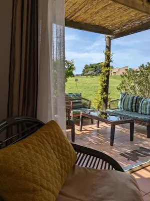 a view of a swimming pool with chairs and trees at Côté Golf, bel appartement RDC avec terrasses dans Golf, piscine, tennis, à 5mn de l'Isle sur la Sorgue in Saumane-de-Vaucluse