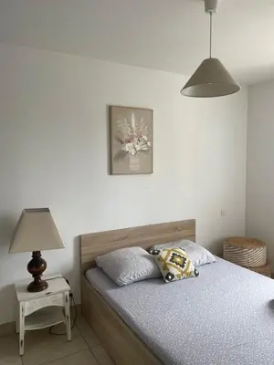 a bedroom with a bed with a stuffed animal on it at Villa Lisa - piscine chauffée in LʼIsle-sur-la-Sorgue
