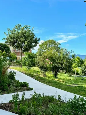 a house with a garden in front of it at Domaine La Ferme HI bride in Villelaure