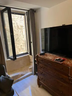 a living room with a couch and a coffee table at APPARTEMENT CAROMB proche Mont VENTOUX avec clim in Caromb