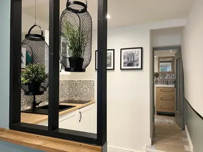 a mirror in a hallway with plants in it at Lou Pitchoun in Aix-en-Provence