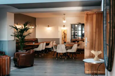 a restaurant with tables and chairs in a room at Domaine Perréal Chambres d'hôtes in Gargas