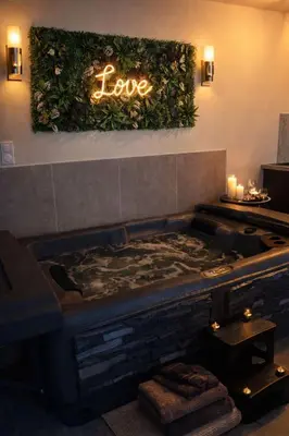 a sign that says love on a wall above a bed at Eden House, Cocon sensuel et romantique avec jacuzzi in Carpentras