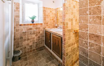 a tiled bathroom with a sink and a window at Gorgeous Home In Roussillon With Wifi in Roussillon