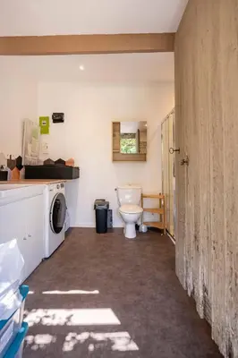 a bathroom with a toilet and a washing machine at Maison de Charme en Provence avec jardin et piscine in Carpentras