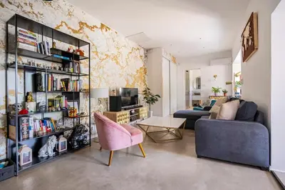 a living room with a couch and a table at Maison de Charme en Provence avec jardin et piscine in Carpentras