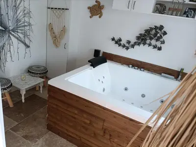 a jacuzzi tub in a room at Cocoon inn&Spa in Saint-Saturnin-les-Avignon