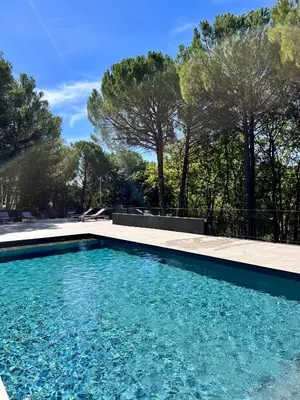 a swimming pool in a yard with trees at Provence mon amour in La Tour-dʼAigues
