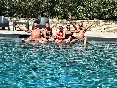 a group of people sitting in a swimming pool at Provence mon amour in La Tour-dʼAigues
