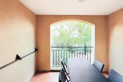 a table and chairs in a room with a window at Village Pont Royal en Provence - maeva Home - Appartement 2 pièces 4 personnes - Prestige MAE-2180 in Mallemort