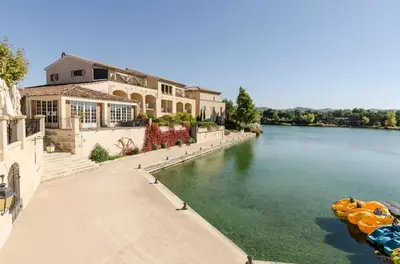 a house on the side of a river at Village Pont Royal en Provence - maeva Home - Studio 5 Personnes Selection MAE-4892 in Mallemort