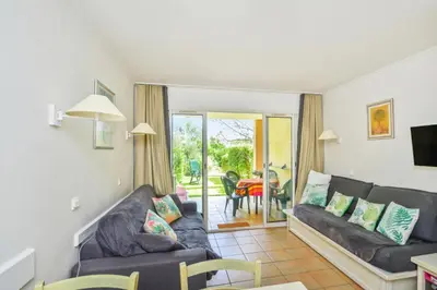 a living room with a couch and a table at Village Pont Royal en Provence - maeva Home - Studio 5 Personnes Selection MAE-4892 in Mallemort