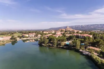 an aerial view of a river with a town at Village Pont Royal en Provence - maeva Home - Appartement 2 pièces 6 personnes climatisé - Prestige MAE-4537 in Mallemort