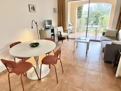 a living room with a table and chairs at Village Pont Royal en Provence - maeva Home - Studio climatisé 4 Personnes - Sélection MAE-7498 in Mallemort