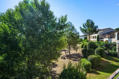 an aerial view of a yard with trees and bushes at Village Pont Royal en Provence - maeva Home - Studio climatisé 4 personnes - Sélection MAE-2907 in Mallemort