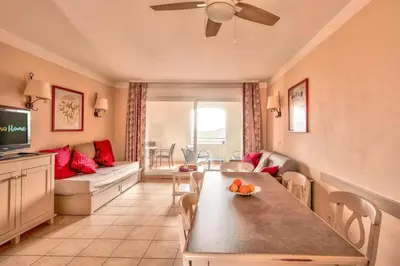 a living room with a couch and a table in a room at Les Coteaux de Pont Royal en Provence - maeva Home - Appartement 3 Pièces 6 Personnes - Sélection MAE-5989 in Mallemort