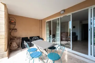 a dining room with a table and chairs at Village Pont Royal en Provence - maeva Home - Appartement 2 Pièces 6 Personnes - Sélection MAE-9534 in Mallemort