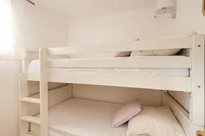 a white bunk bed in a white room at Village Pont Royal en Provence - maeva Home - Appartement 2 Pièces 6 Personnes - Sélection MAE-9534 in Mallemort