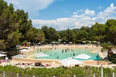 a group of people in a swimming pool at Résidence Hôtel du Golf de Pont Royal - maeva Home - Appartement climatisé ravissant 2 pièces 4 personnes - Prestige - super Home MAE-3104 in Mallemort