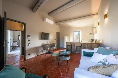 a living room with a couch and a table at La Terrasse d'Eygalières in Eygalières