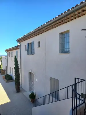 a large white house with a staircase leading up to it at Le Mas Joséphine in Saint-Rémy-de-Provence