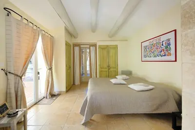 a bedroom with a bed with two pillows on it at Maison de Charme au Pays de Cézanne in Aix-en-Provence