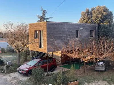 a house with a car parked in front of it at campdebaseventoux, vue sur le ventoux insolite in Bédoin