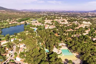 an aerial view of a resort with a lake at Les Maisons de Pont Royal en Provence - maeva Home - Maison 3 pièces 6 personnes - Sélection MAE-1676 in Mallemort