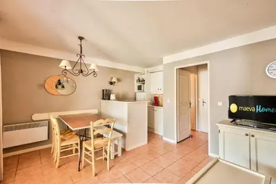 a kitchen and dining room with a table and chairs at Les Maisons de Pont Royal en Provence - maeva Home - Maison 3 pièces 6 personnes - Sélection MAE-1676 in Mallemort