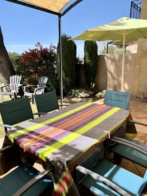 a table with chairs and an umbrella on a patio at Les Maisons de Pont Royal en Provence - maeva Home - Maison 3 pièces 6 personnes - Sélection MAE-2277 in Mallemort