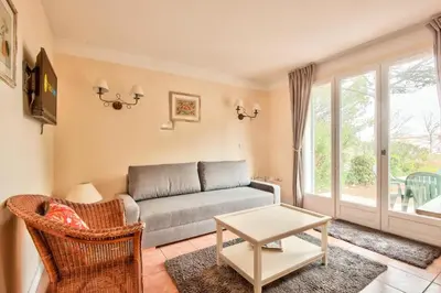 a living room with a couch and a table at Les Maisons de Pont Royal en Provence - maeva Home - Maison 3 pièces 6 personnes climatisé - Sélection MAE-6421 in Mallemort