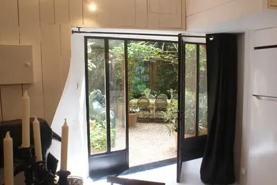 an open door to a patio in a house at La BARBELLA in Lourmarin