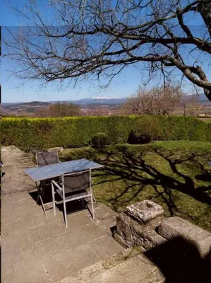 a table and two chairs sitting on a patio at Le Lavoir in Lacoste