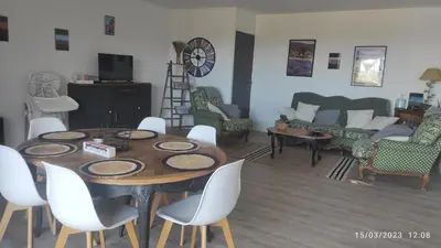 a living room with a table and chairs and a couch at Une escapade en Luberon in Bonnieux