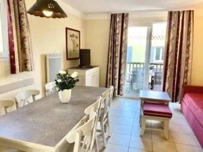 a dining room with a table and chairs and a couch at Maison de Vacances en Provence avec Piscine, Golf à Proximité, Fibre et Linge Haut de Gamme - FR-1-658-9 in Mallemort